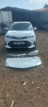 Replaced grille, headlight and bonnet laid out