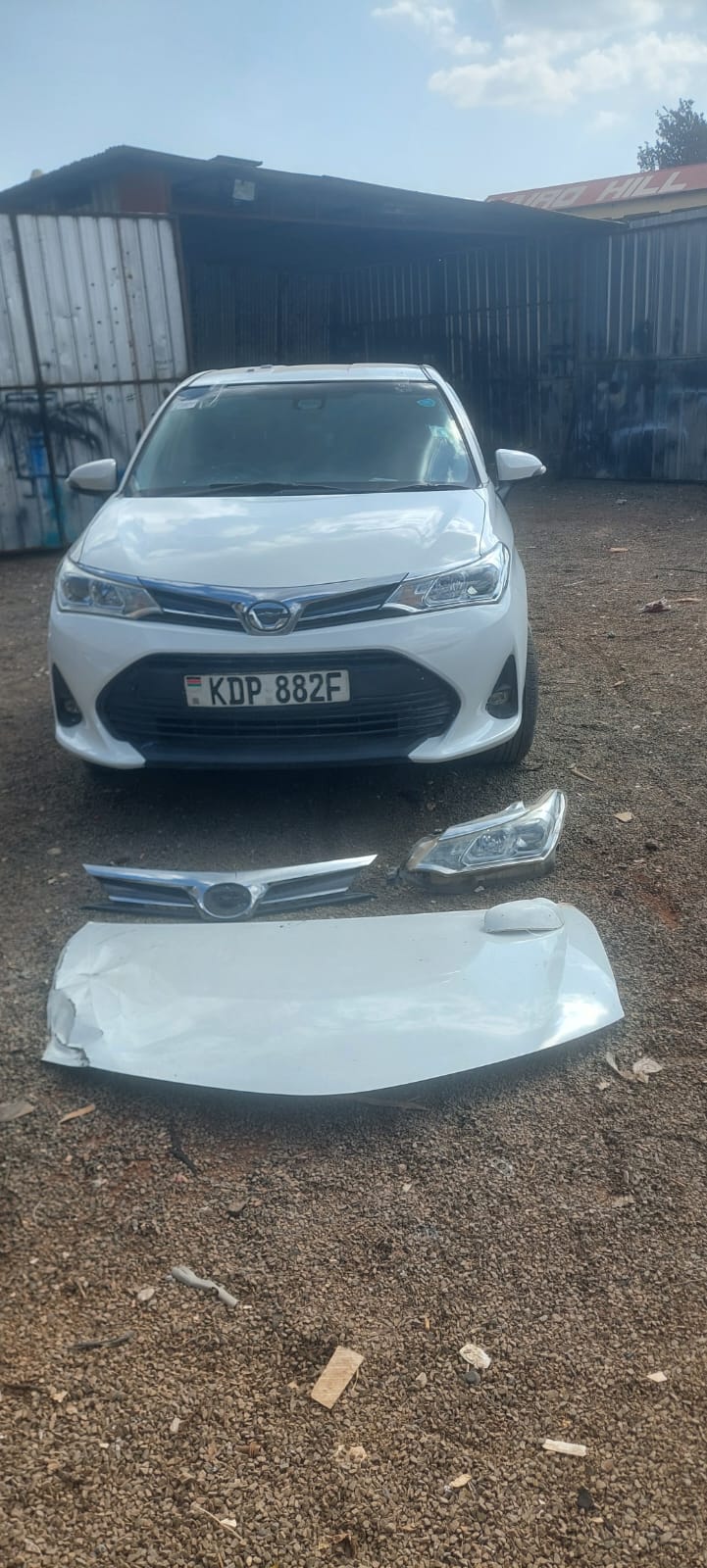 Toyota Axio KDP 882F, wider view of completed repair