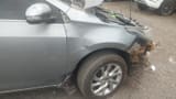 Dented fender before repair